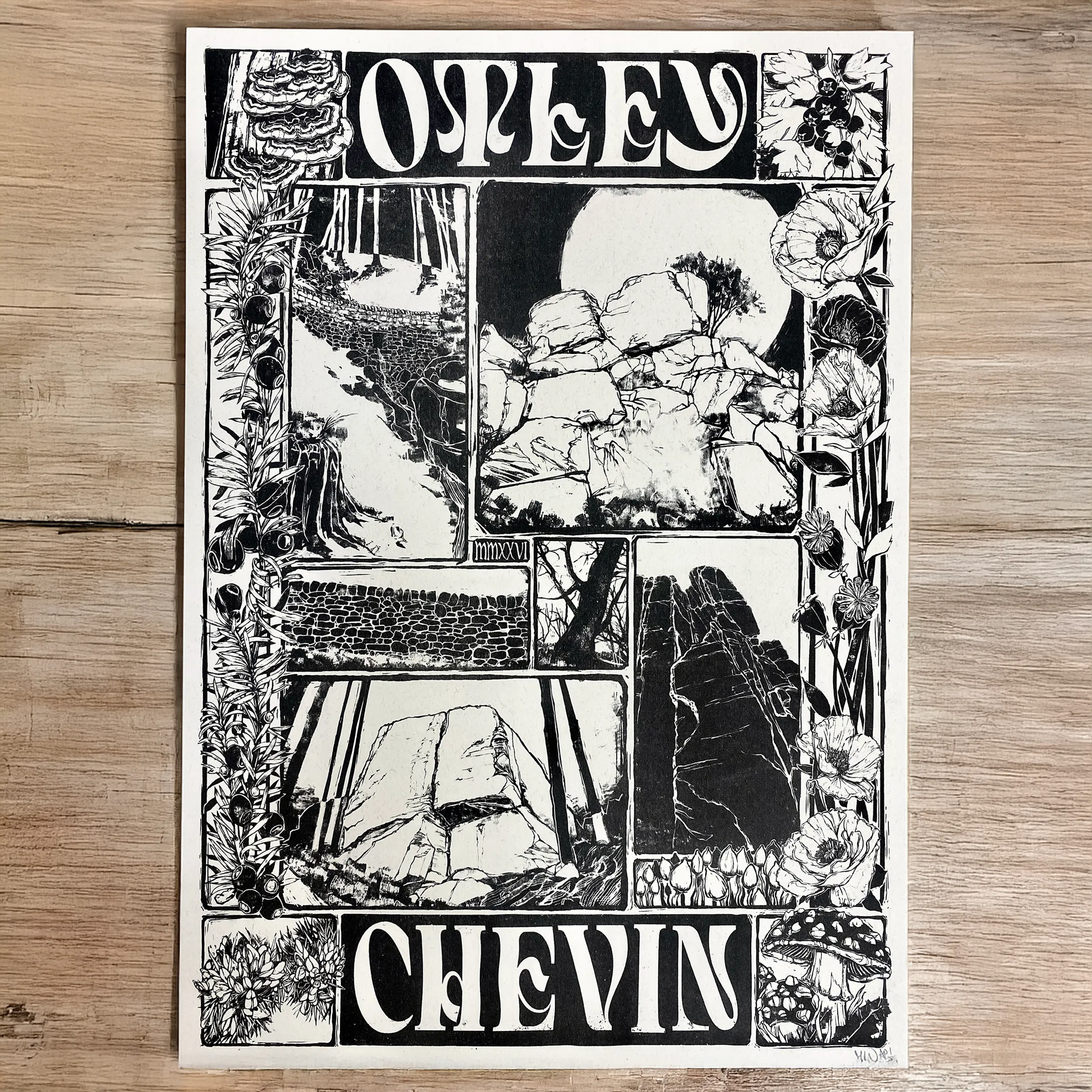 The print lying on a wooden table.